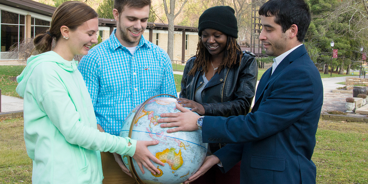 Allegany College of Maryland Students Looking at a Globe