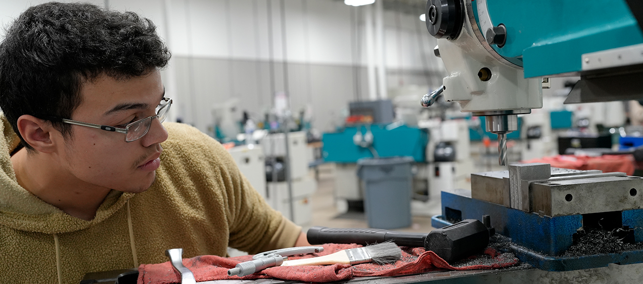 Student working on a machine