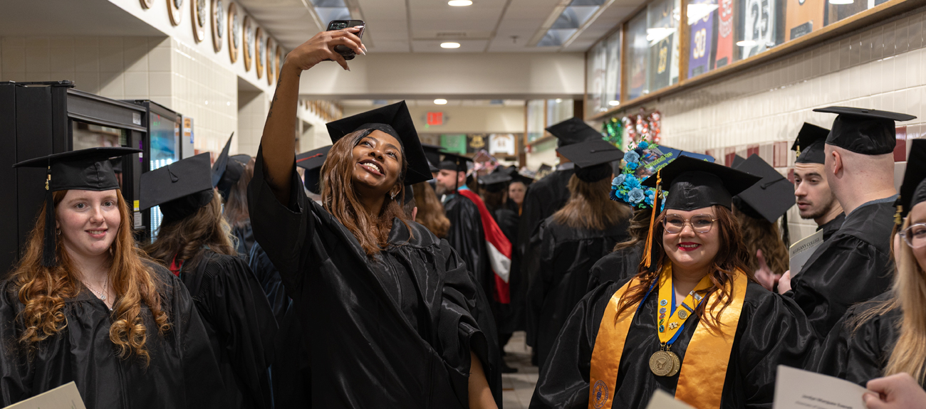 Student taking a selfie on graduation night