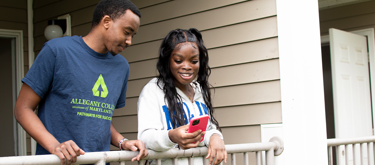 Students standing on the porch